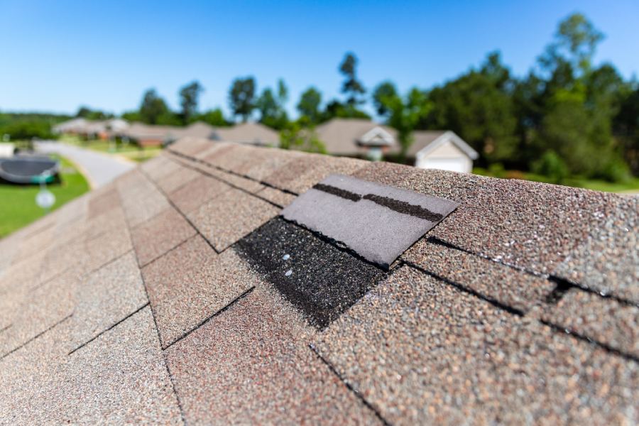wind damaged shingles and hidden roof leaks